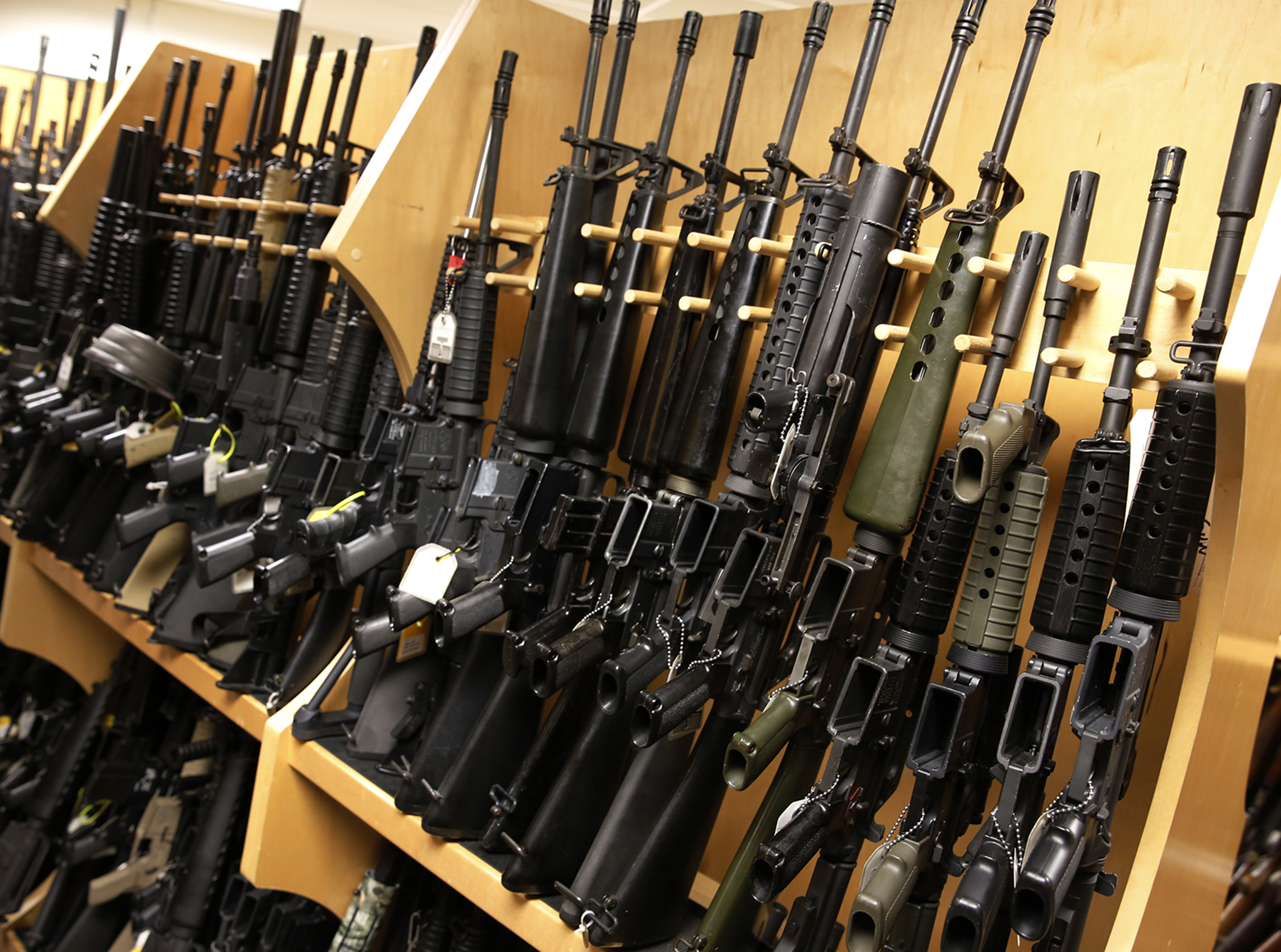 AR-15 rifles line a shelf in the gun library at the ATF National Tracing Center in Martinsburg, West Virginia