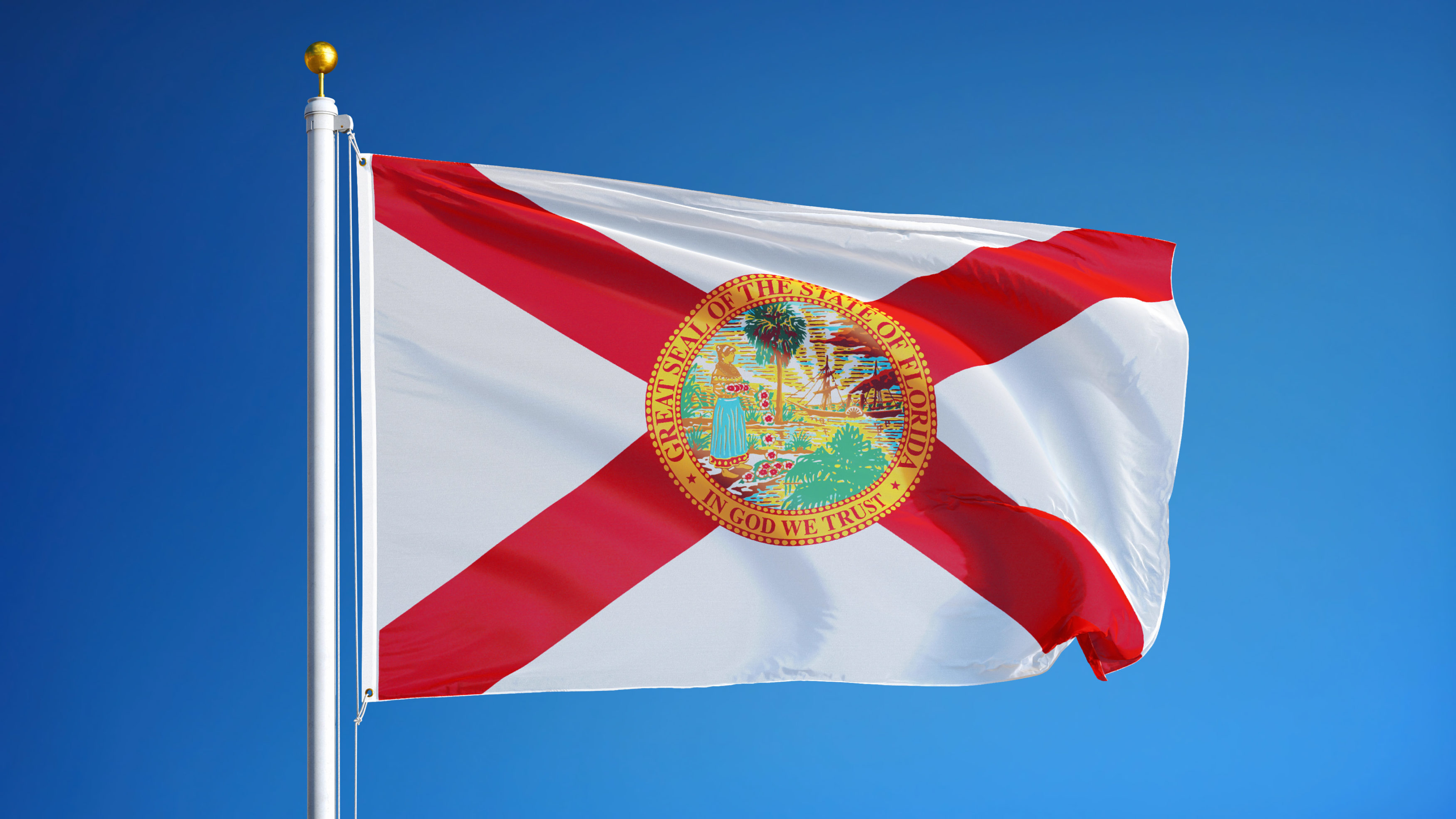 Florida (U.S. state) flag waving against clear blue sky, close up, isolated with clipping path mask alpha channel transparency, perfect for film, news, composition