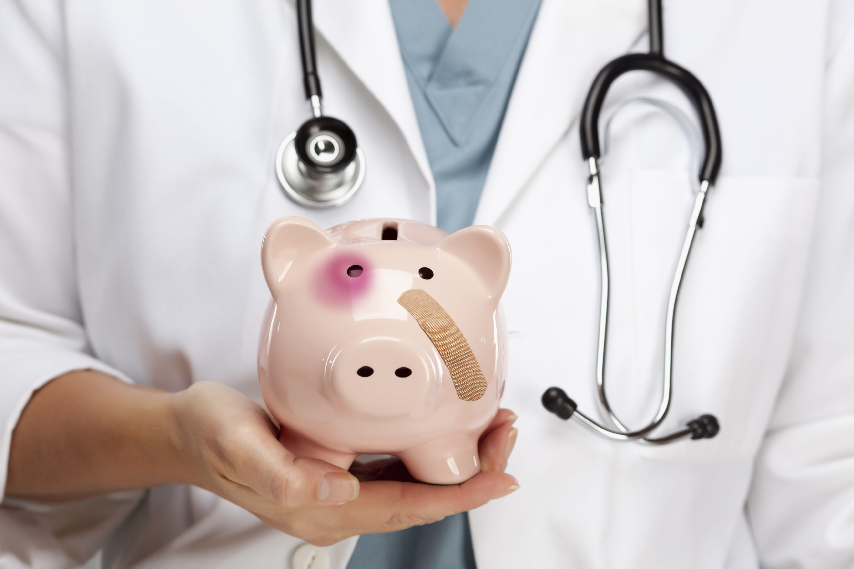 Female Doctor with Stethoscope Holding Piggy Bank with Bruised Eye and Bandage.