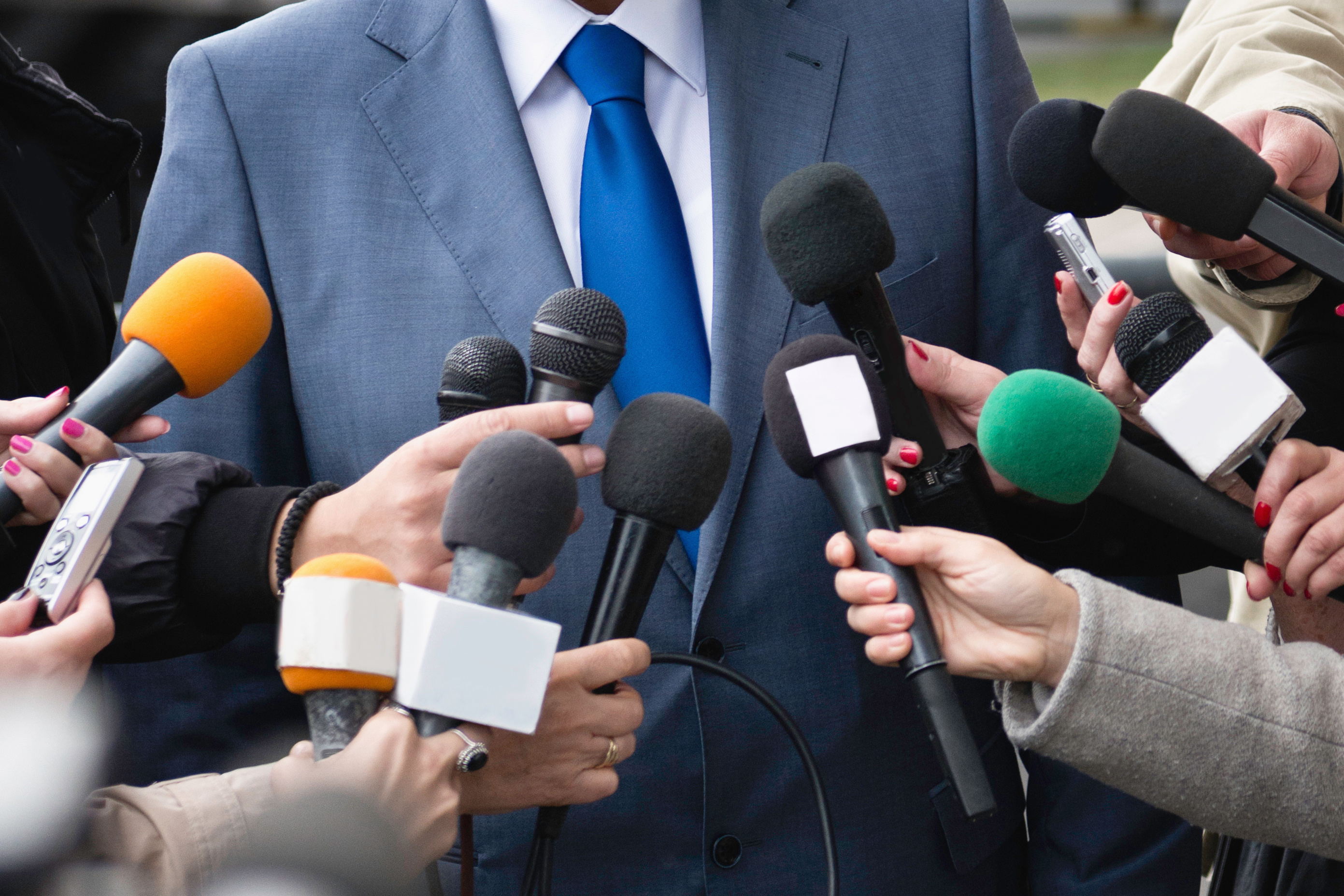 Politician answering media questions