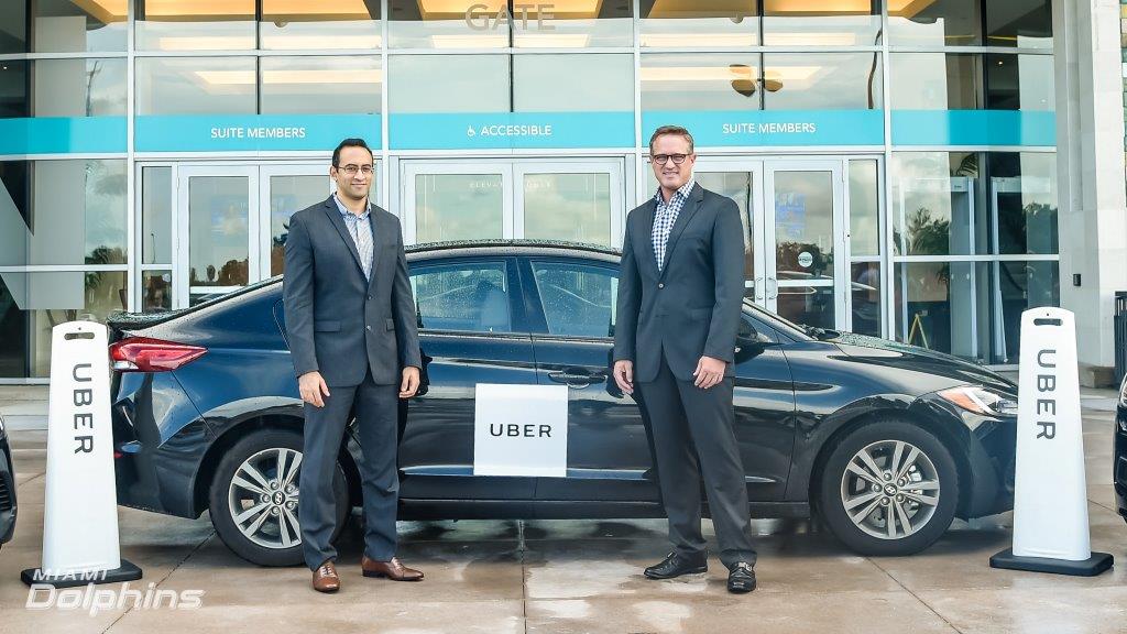 (L-R) Uber South Florida General Manager Kasra Moshkani with Dolphins President & CEO Tom Garfinkel welcome Uber to Hard Rock Stadium