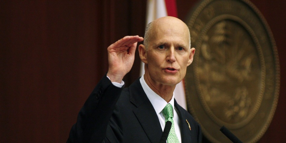 Rick Scott plays airplane