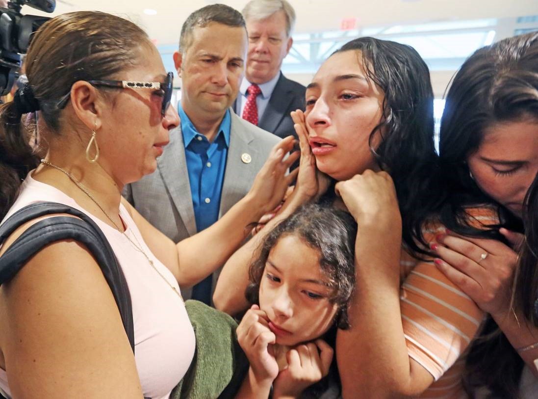 Alejandra Juarez says goodbye to daughters Pamela, 16, and Estella, 8, as U.S. Rep. Darren Soto looks on.