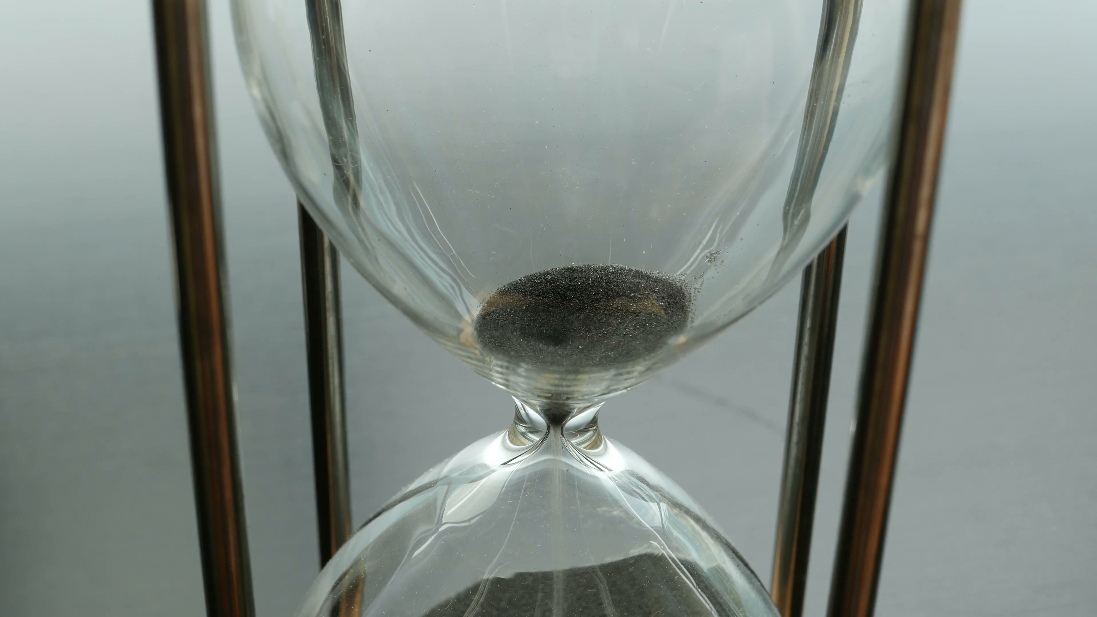 hourglass-black-sand-time-runs-out-the-upper-portion-of-an-hourglass-with-black-sand-time-running-out-concept_ejzawl0t__F0000-3500x1969.png