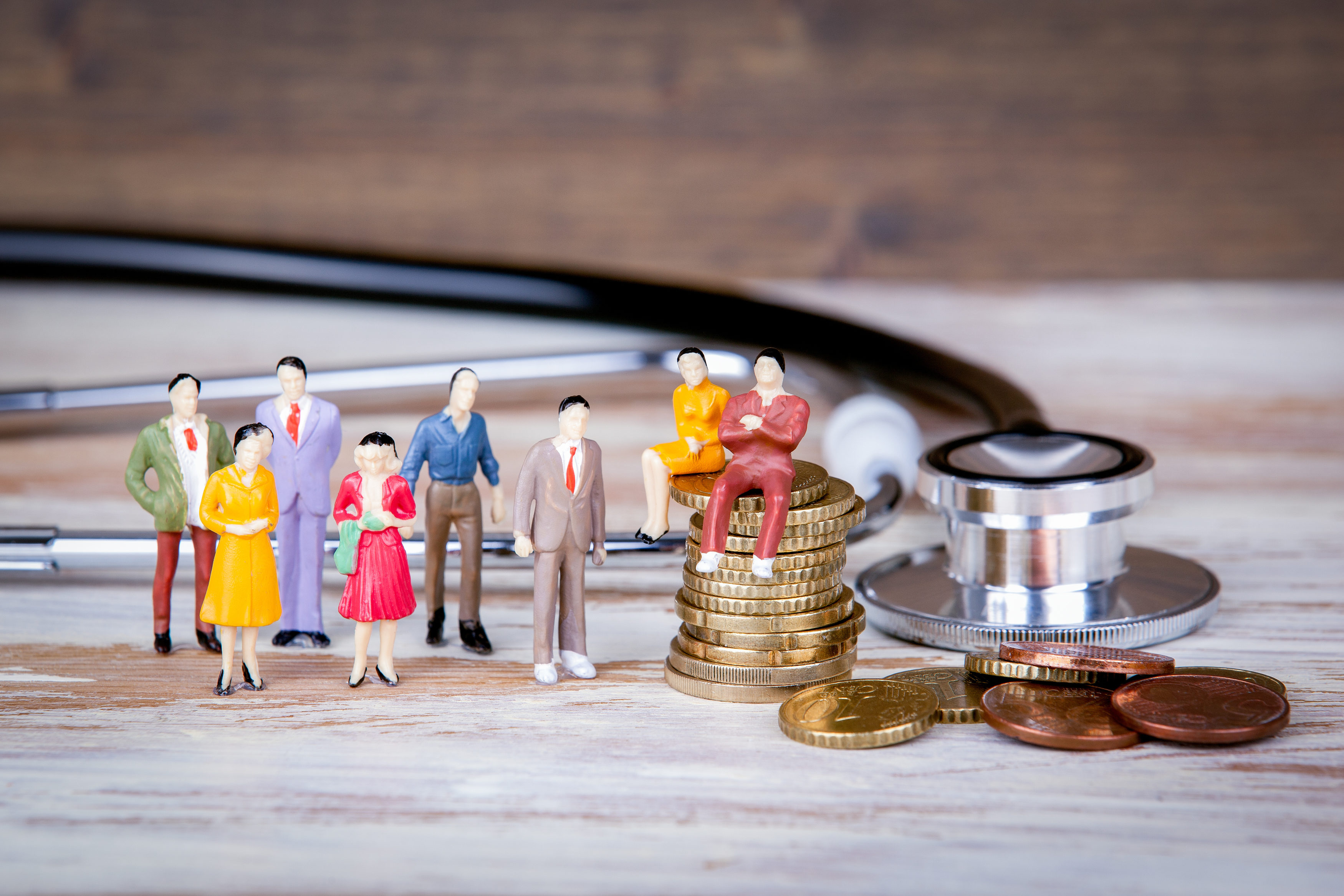 Medical care and expenses, health insurance. Colorful Human miniatures.