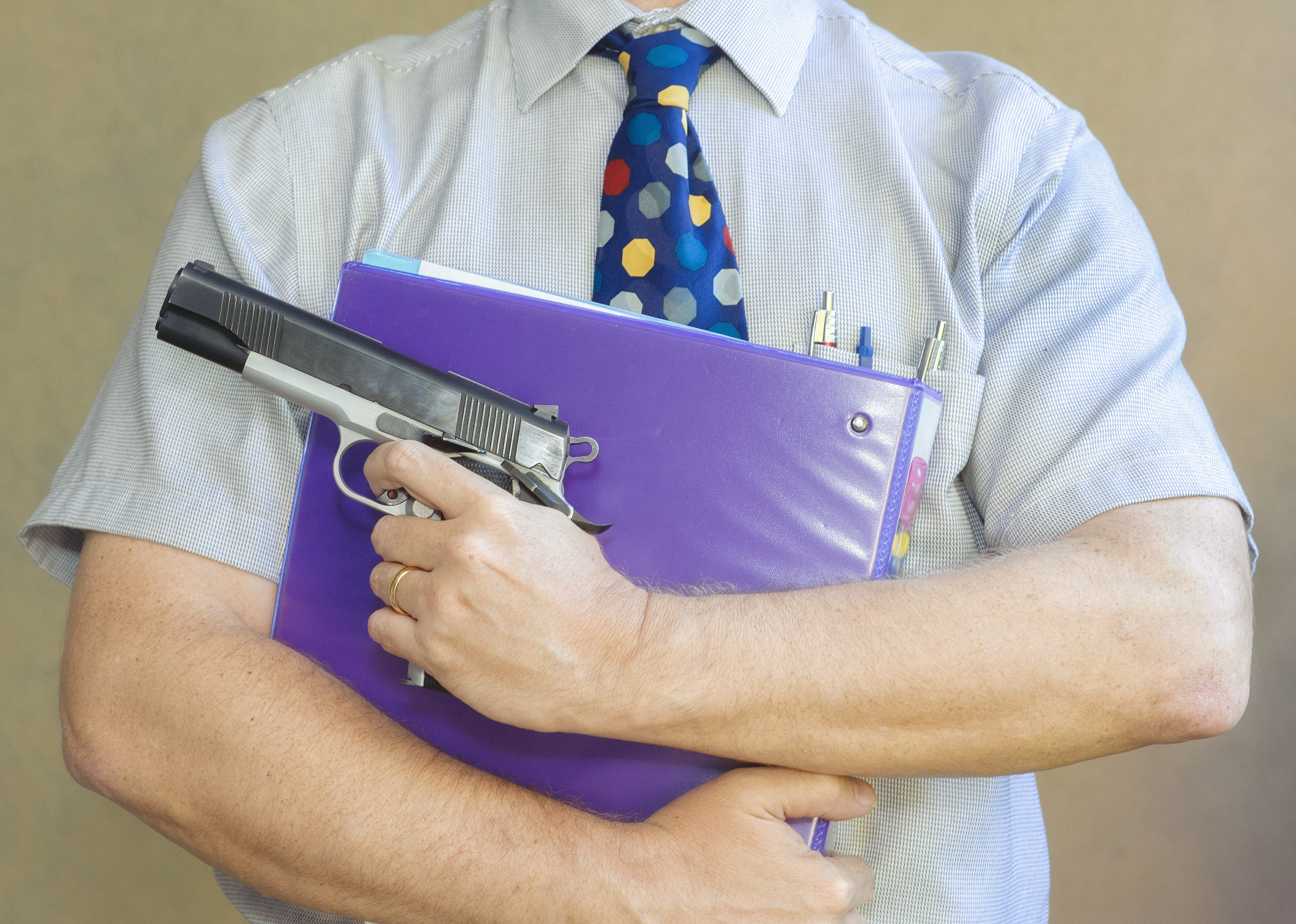 teacher-with-gun-3500x2495.jpeg