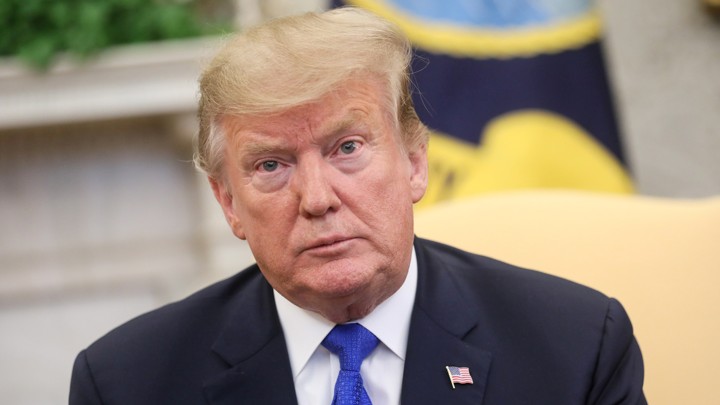 U.S. President Donald Trump meets with former hostage Danny Burch and his family in the Oval Office at the White House