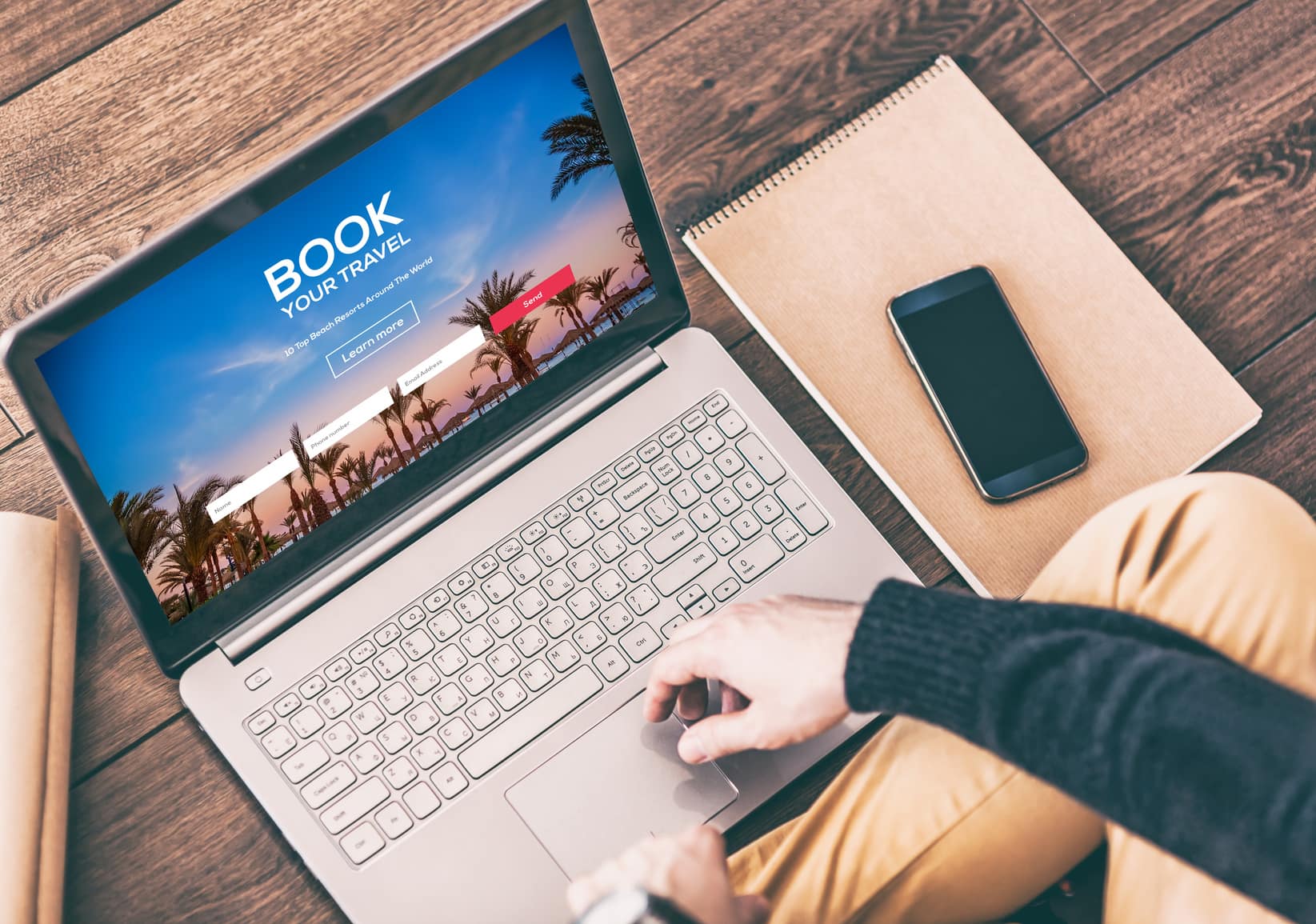 Man using a modern laptop for booking hotel online. Tour reservation