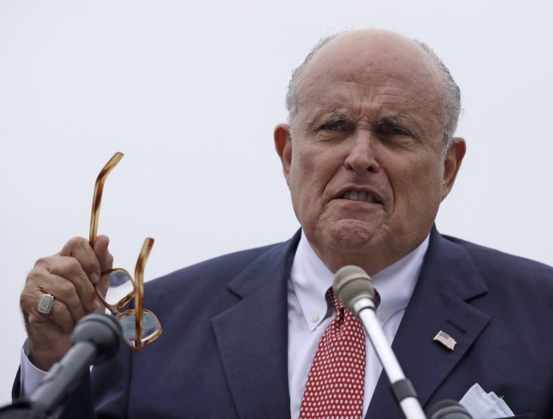 giuliani, rudy - holding glasses