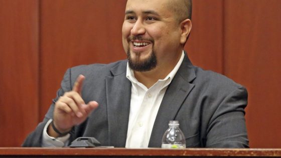 FILE- In this Sept. 13, 2016 file photo, George Zimmerman smiles as he testifies in a Seminole County courtroom in Orlando, Fla. Zimmerman, who was acquitted of the 2012 killing of an unarmed black teen Trayvon Martin, has filed a lawsuit, Wednesday, Dec. 4, 2019, against the teens' parents, family attorney and prosecutors who tried his case, claiming they coached a witness to give false testimony. (Red Huber/Orlando Sentinel via AP, Pool, File)