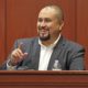 FILE- In this Sept. 13, 2016 file photo, George Zimmerman smiles as he testifies in a Seminole County courtroom in Orlando, Fla. Zimmerman, who was acquitted of the 2012 killing of an unarmed black teen Trayvon Martin, has filed a lawsuit, Wednesday, Dec. 4, 2019, against the teens' parents, family attorney and prosecutors who tried his case, claiming they coached a witness to give false testimony. (Red Huber/Orlando Sentinel via AP, Pool, File)