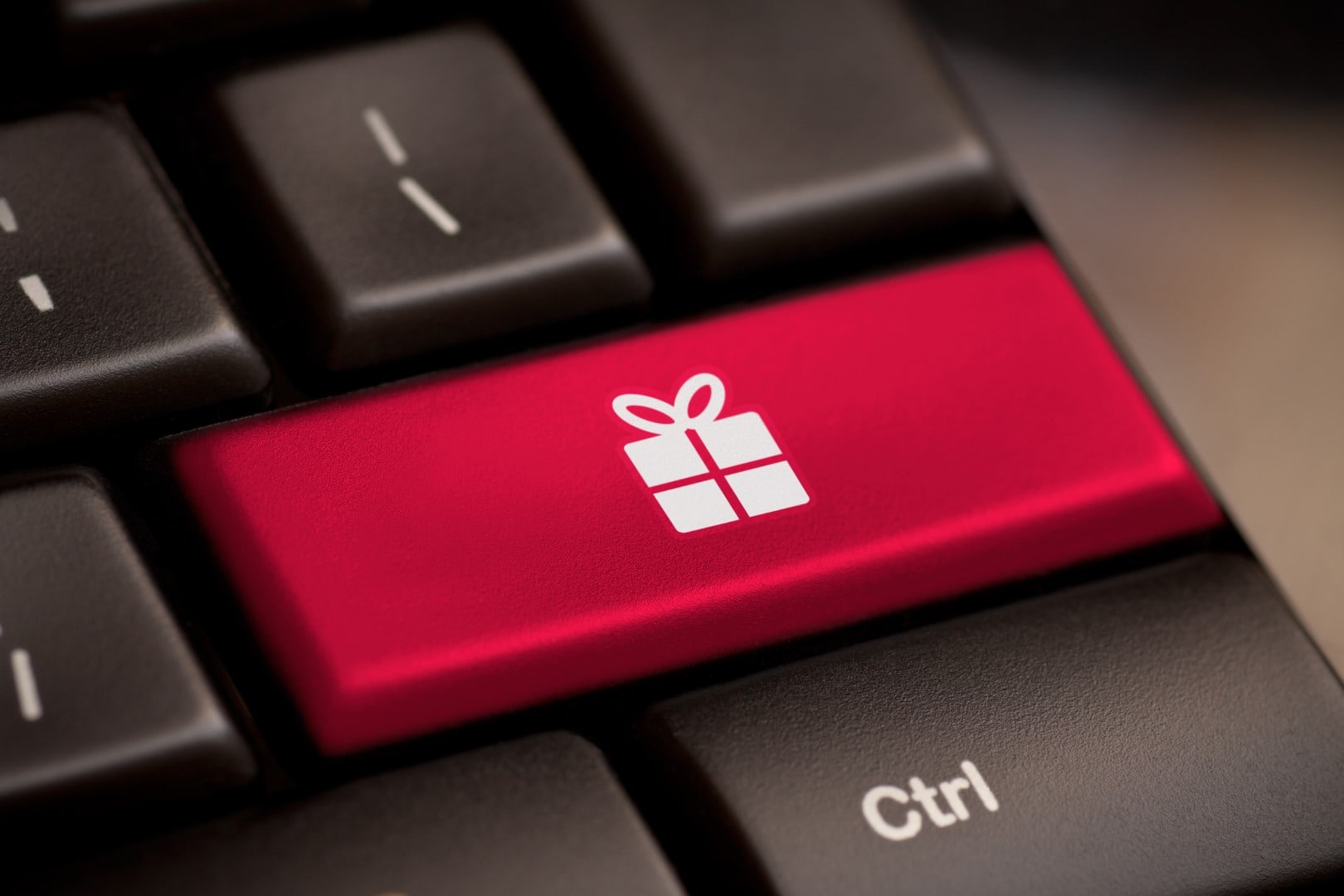 Gift button on keyboard with soft focus