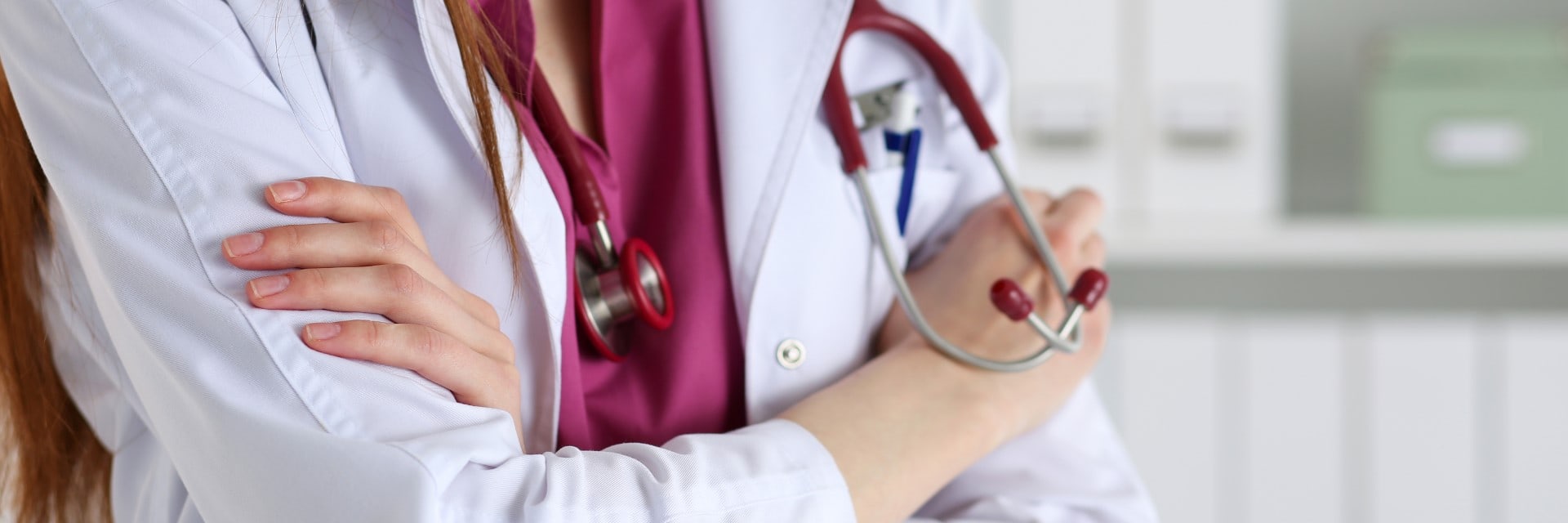 Female medicine doctor hands crossed on her chest