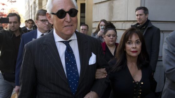 FILE - In this Nov. 15, 2019, file photo, Roger Stone, left, with his wife Nydia Stone, leaves federal court in Washington, Friday, Nov. 15, 2019. Federal prosecutors are asking a judge to sentence Stone to serve between 7 and 9 years in prison after his conviction on witness tampering and obstruction charges. (AP Photo/Jose Luis Magana, File)
