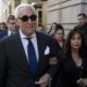 FILE - In this Nov. 15, 2019, file photo, Roger Stone, left, with his wife Nydia Stone, leaves federal court in Washington, Friday, Nov. 15, 2019. Federal prosecutors are asking a judge to sentence Stone to serve between 7 and 9 years in prison after his conviction on witness tampering and obstruction charges. (AP Photo/Jose Luis Magana, File)