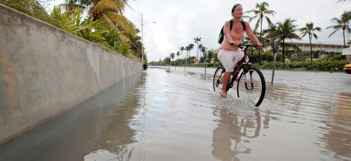 gw-impacts-sea-level-rise-key-west-florida-biker-flooded-streets