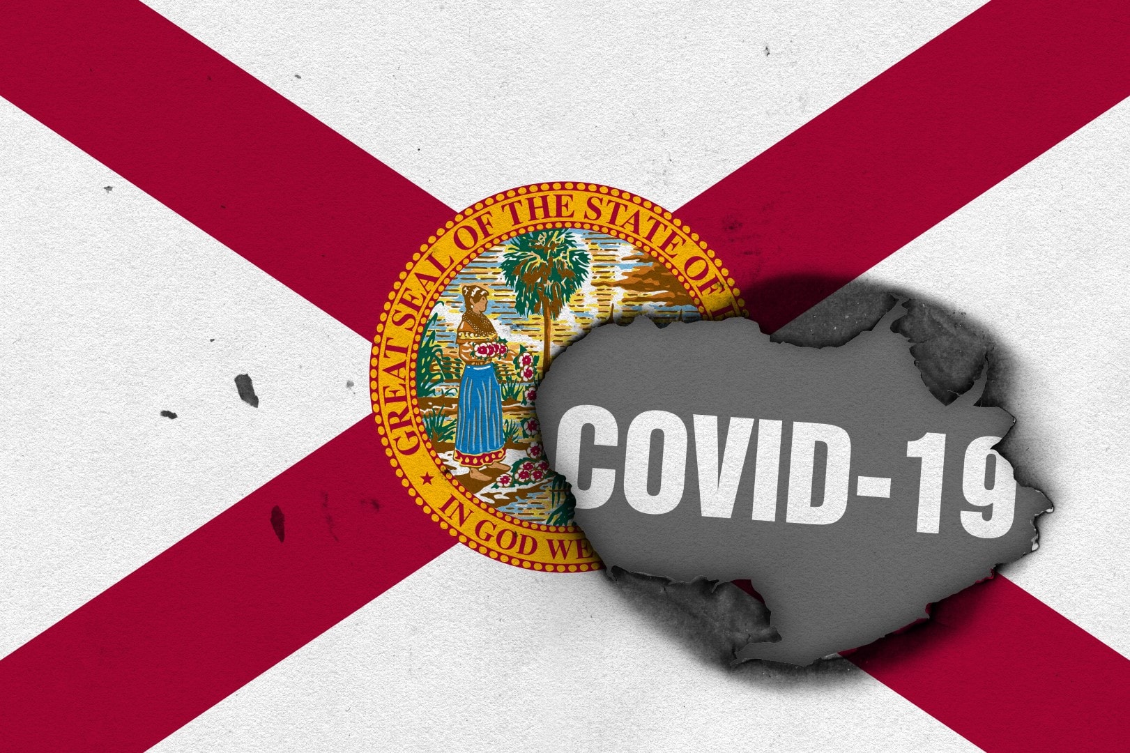 Flag of the state of Florida with burned out hole showing Coronavirus name in it. 2019 - 2020 Novel Coronavirus (2019-nCoV) concept, for an outbreak occurs in Florida, USA.