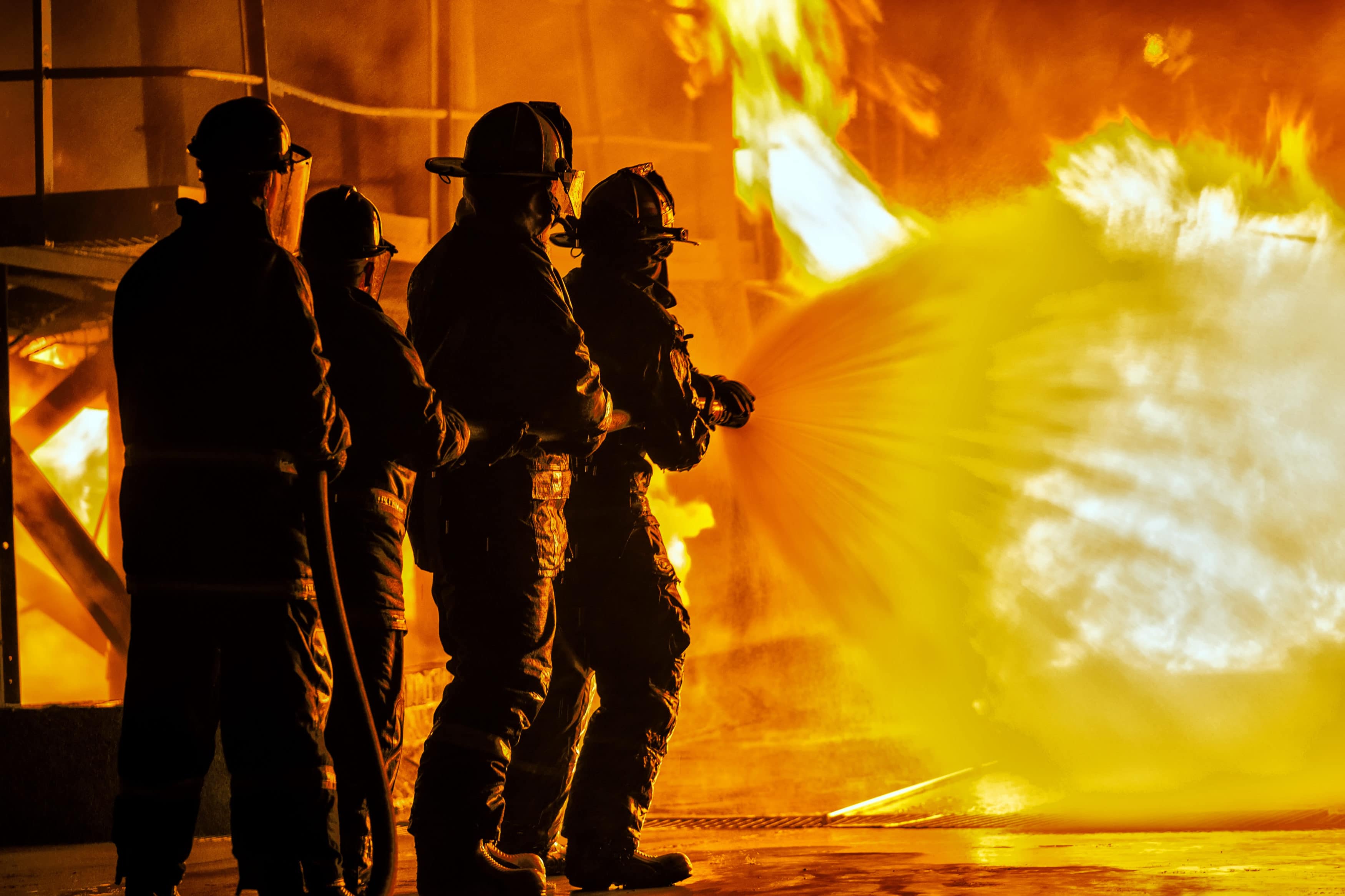 JOHANNESBURG, SOUTH AFRICA - MAY, 2018 Firefighters spraying down fire during firefighting training exercise