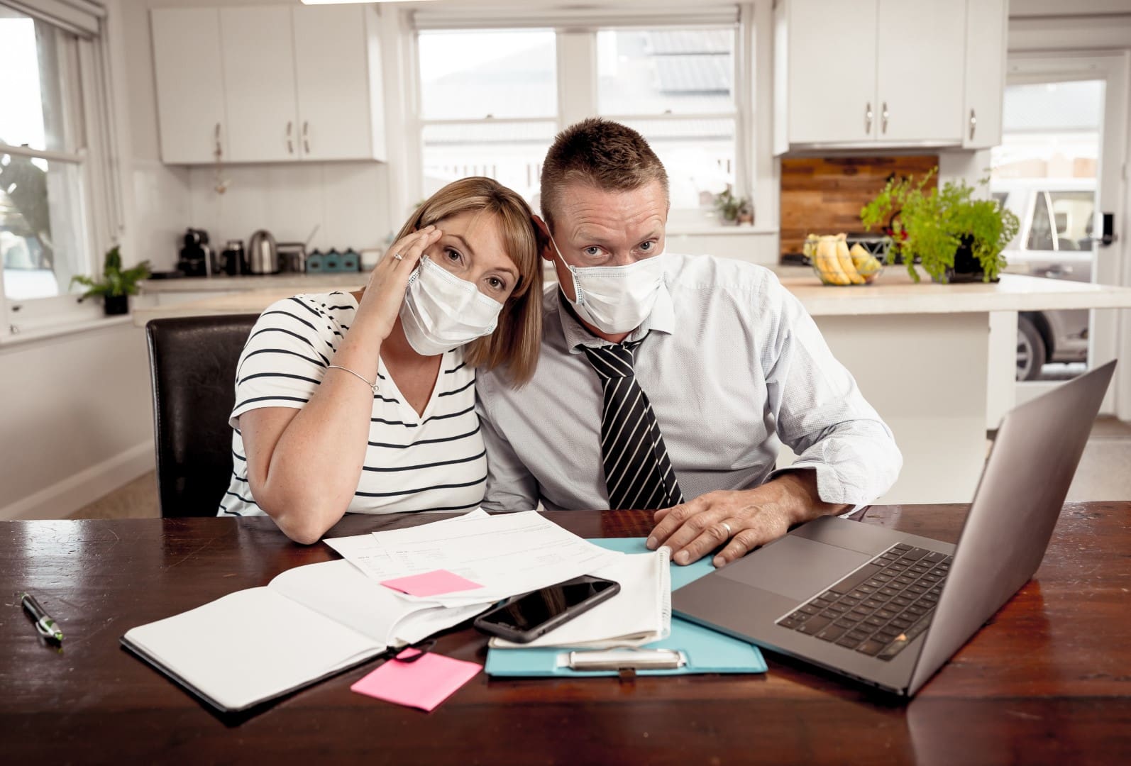 Coronavirus Economic recession. Couple in self isolation over home finances during Covid-19 shutdown