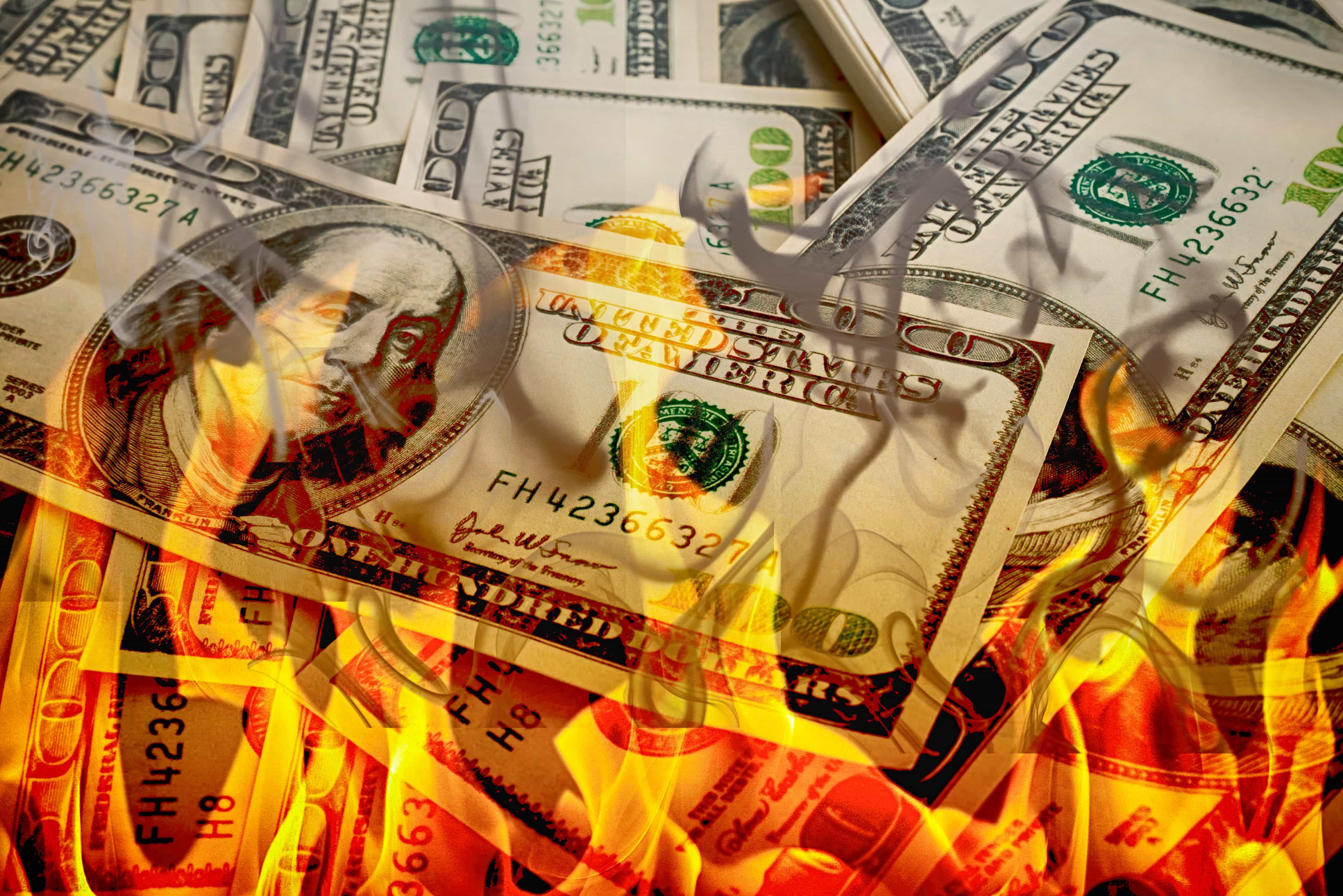 Crisis,dollars in fire, burning dollar