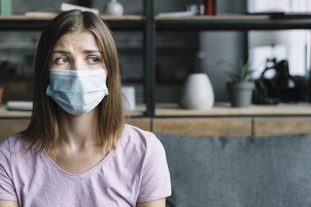 sick-woman-wearing-protective-mask-home_23-2147953259.jpg