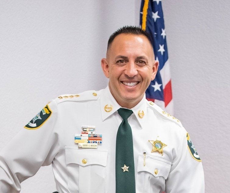 Lee County Sheriff Carmine Marceno throws out a ceremonial first