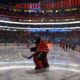 FILE - In this Feb. 20, 2020, file photo, Edmonton Oilers goalie Mike Smith warms up for the team's NHL hockey game against the Winnipeg Jets in Edmonton, Alberta. Deputy Commissioner Bill Daly told The Associated Press on Sunday, July 5, that the NHL and NHL Players’ Association have agreed on protocols to resume the season. Daly said the sides are still negotiating a collective bargaining agreement extension. A CBA extension is still crucial to the process. (Jason Franson/The Canadian Press via AP, File)