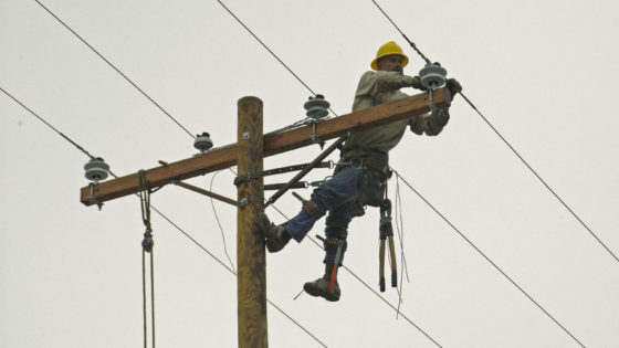 Cameron, LA 11-17-05 Lineman Marion Chappell from Utah repairs damaged powerr wires wipped out by Hurricane Rita. FEMA is helping Local governments get Roads, Bridges, and Utilities back in operation so residents can move back. MARVIN NAUMAN/FEMA photo