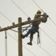 Cameron, LA 11-17-05 Lineman Marion Chappell from Utah repairs damaged powerr wires wipped out by Hurricane Rita. FEMA is helping Local governments get Roads, Bridges, and Utilities back in operation so residents can move back. MARVIN NAUMAN/FEMA photo