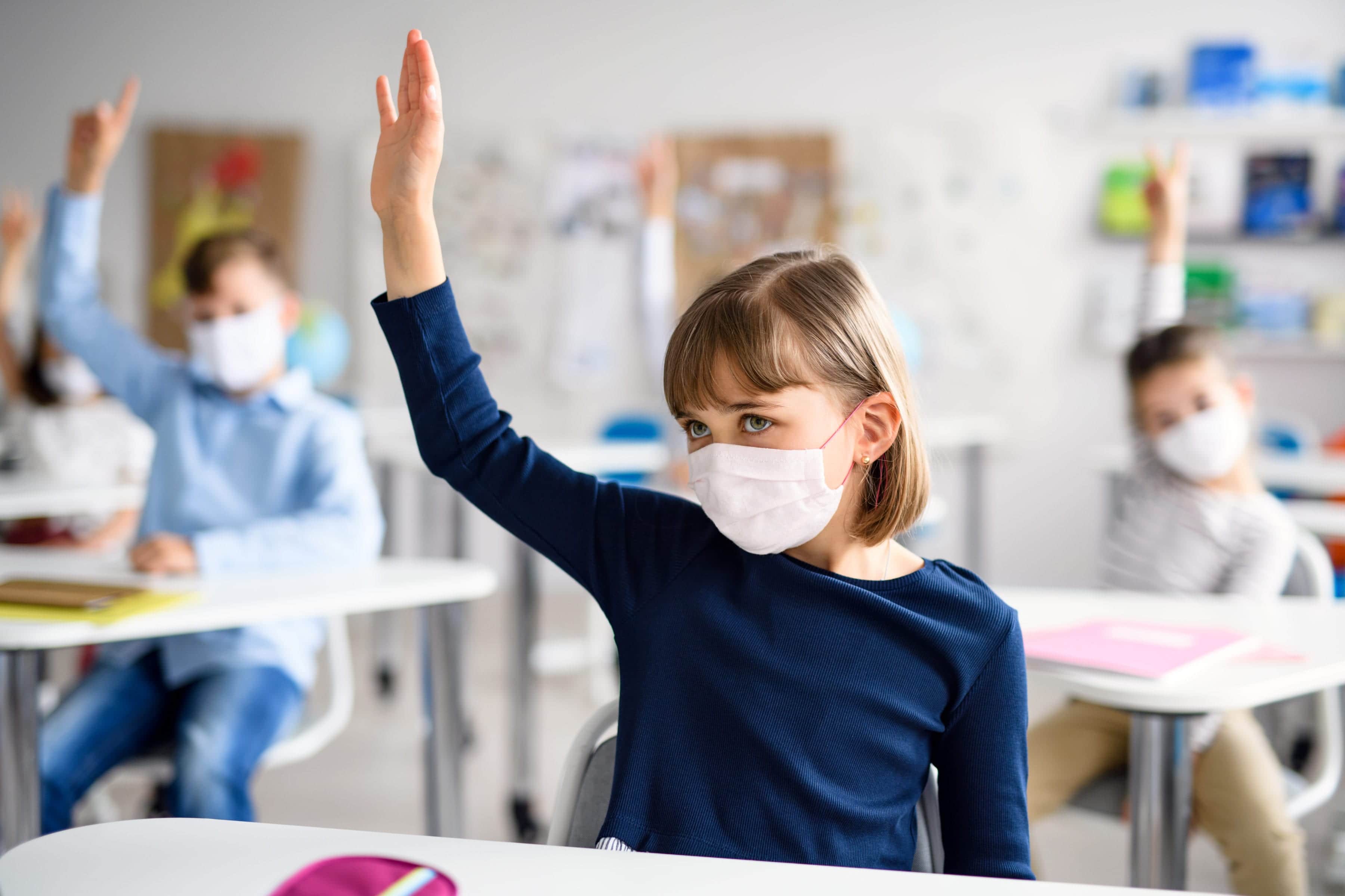child-with-face-mask-back-at-school-after-covid-19-JNMLF65.jpg