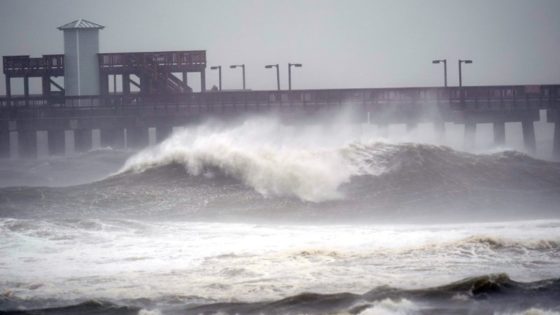 Waves crash near a pier, at Gulf State Park, Tuesday, Sept. 15, 2020, in Gulf Shores, Ala. Hurricane Sally is crawling toward the northern Gulf Coast at just 2 mph, a pace that's enabling the storm to gather huge amounts of water to eventually dump on land. (AP Photo/Gerald Herbrt)