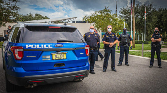 Police officers stand by during a protest in New Port Richey, Florida on Aug. 23, 2020.