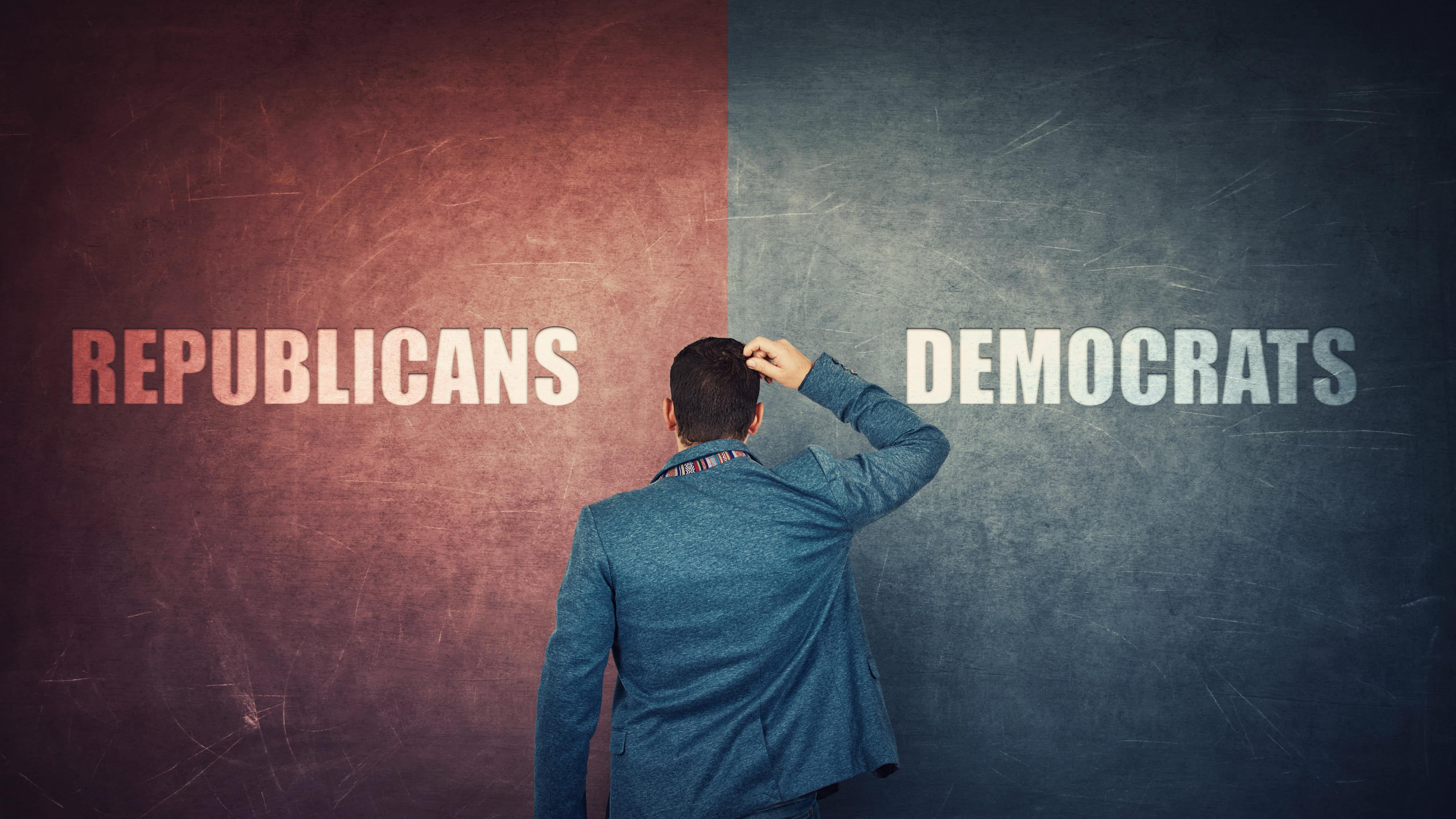 Puzzled businessman and a split wall with Democrats versus Republicans, red vs blue sides. Correct choice, left or right. Difficult decision and doubt concept. Future presidential elections.