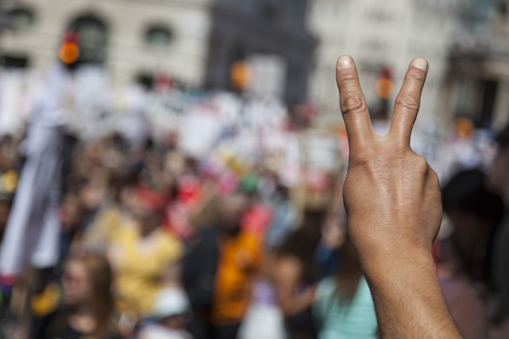 A raised hand of a protestor at a political demonstration