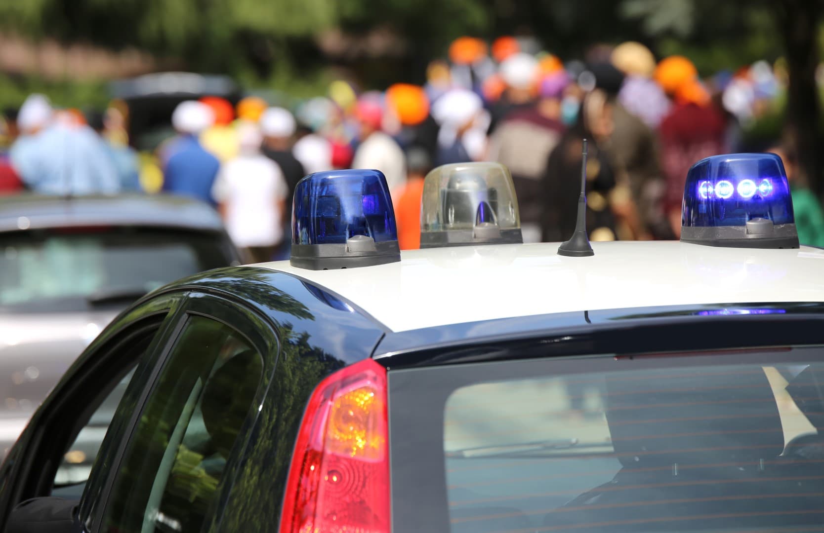 Police patrol cars flashing sirens