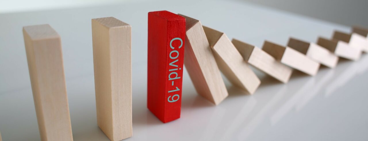 Red wooden block with Covid19 sign close-up background
