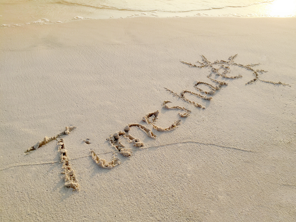 Inscription "Timeshare" in the sand on a tropical island,  Maldives.