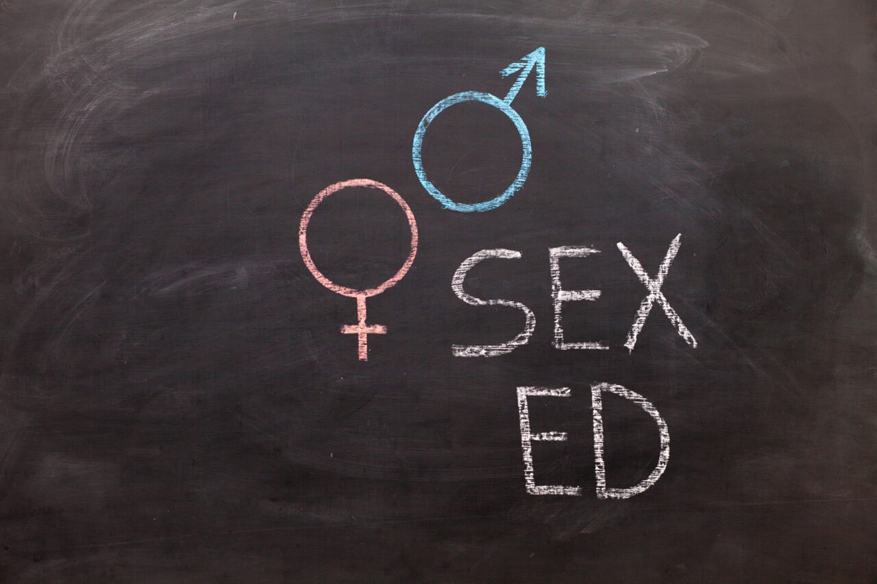 School blackboard with text SEX ED