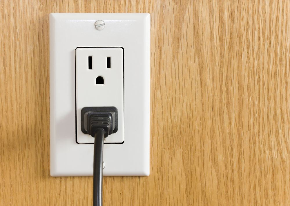 Electrical outlet with black power cord
