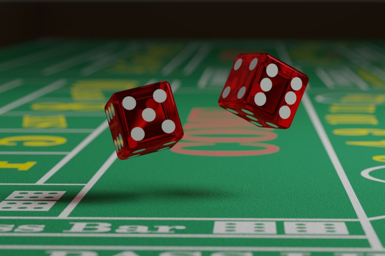 Close up of dice rolling on a craps table. Random concept.