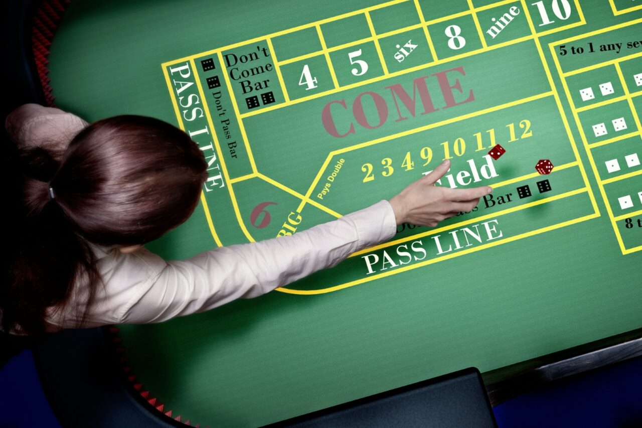 dice throw on craps table at casino