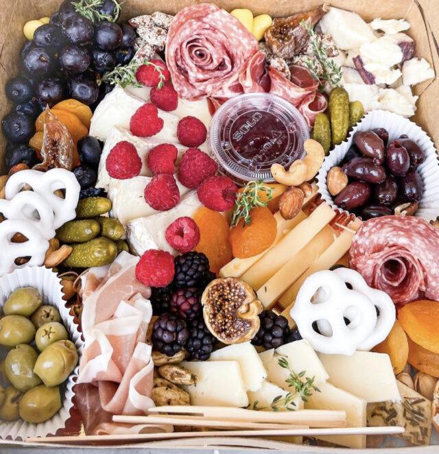 Salami roses star in this elaborate board by Say Cheese, created by Brittany Barnhart. Photo via Say Cheese.