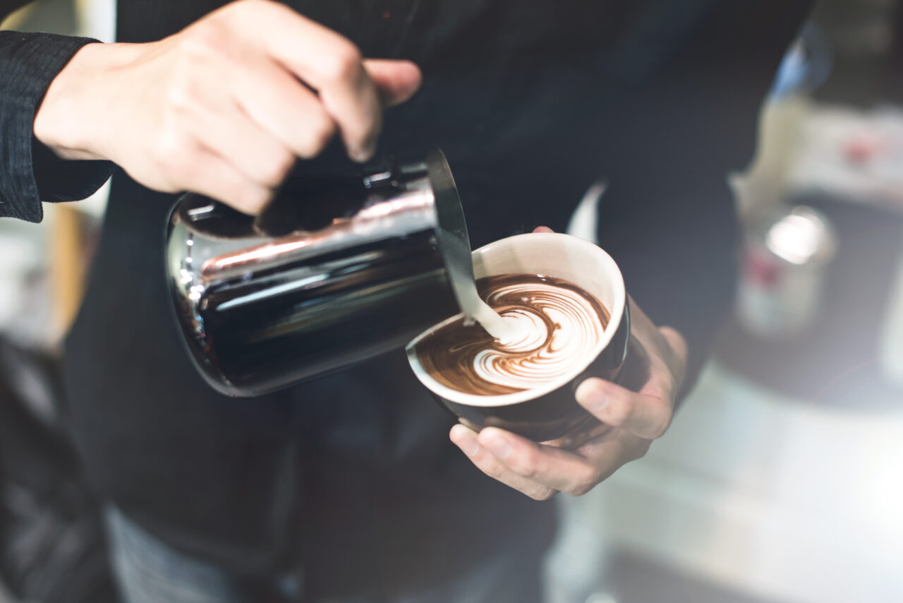 Barista make coffee cup latte art