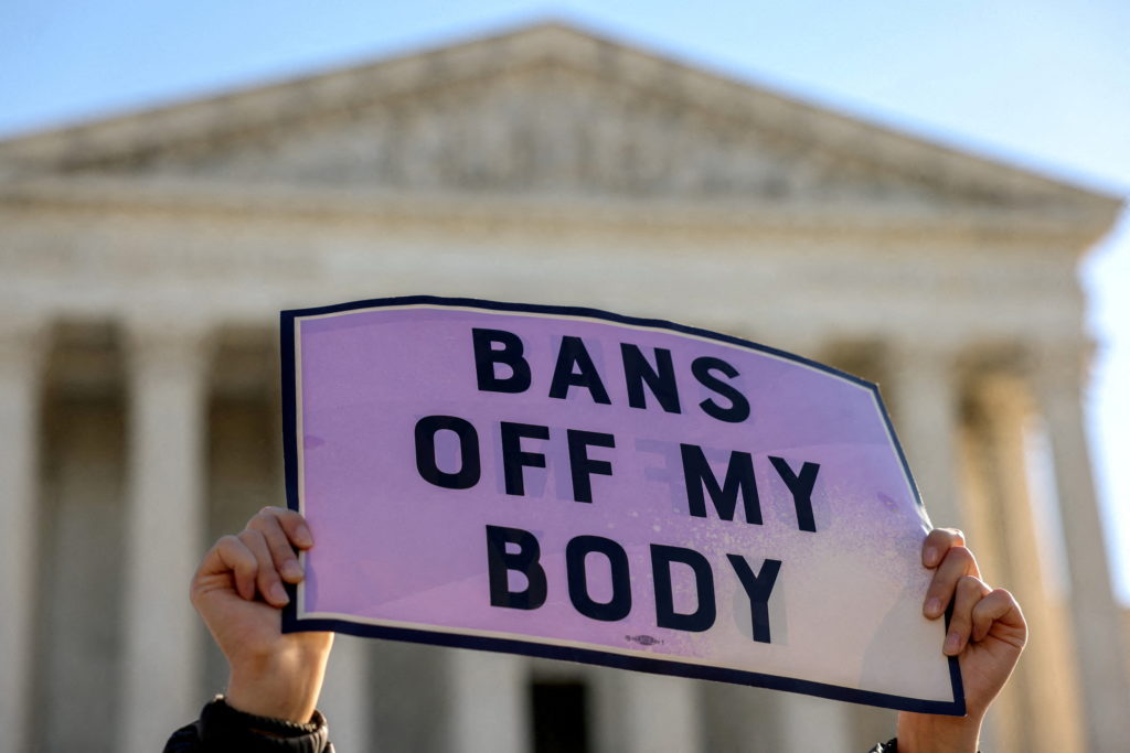 FILE PHOTO: Protestors demonstrate outside U.S. Supreme Court as the court weighs Texas abortion law, in Washington