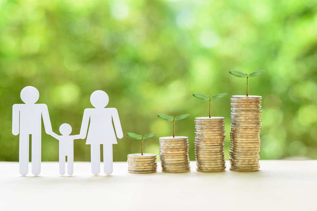 Grant funding. Family or child trust fund / fundraising concept : Family members, sprouts on coins on a table, depicts grantor establishes a trust fund to provide financial security to an individual e.g grandchild