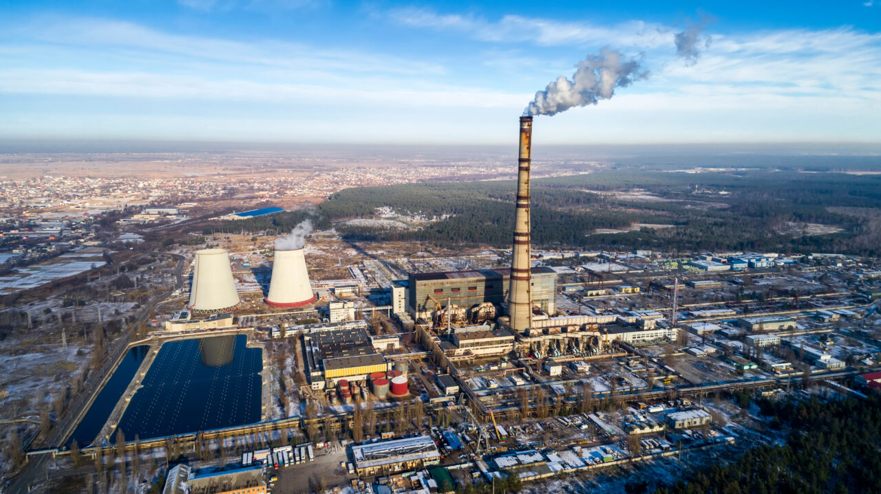 Garbage incineration plant. Waste incinerator plant with smoking smokestack. The problem of environmental pollution by factories