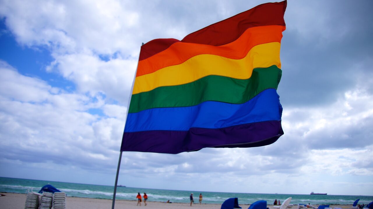 A large rainbow flag flies at the 12th Street Beach, South Beach, Miami