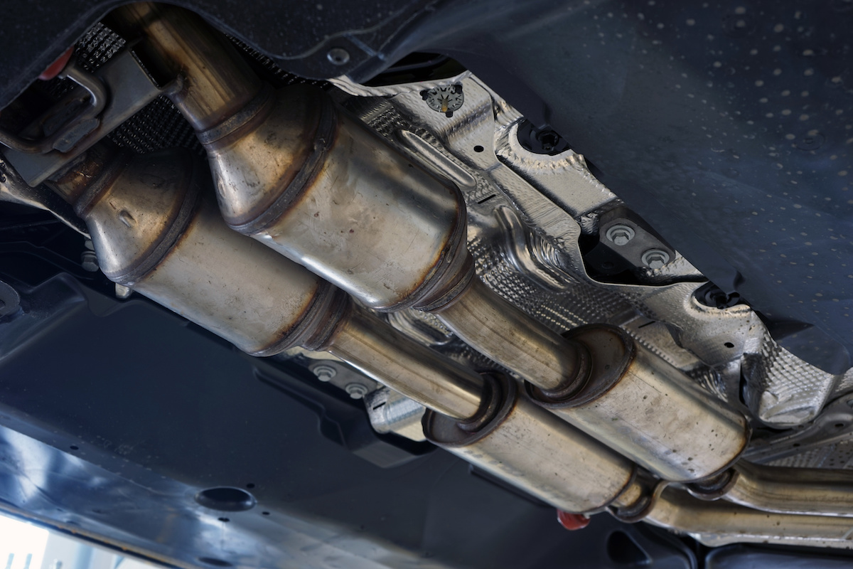 A catalytic converter (catalyst) installed on a modern car. Equipment for reducing harmful emissions into the atmosphere.