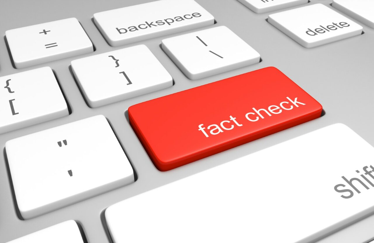 Key on a computer keyboard for fact checking statements or bogus