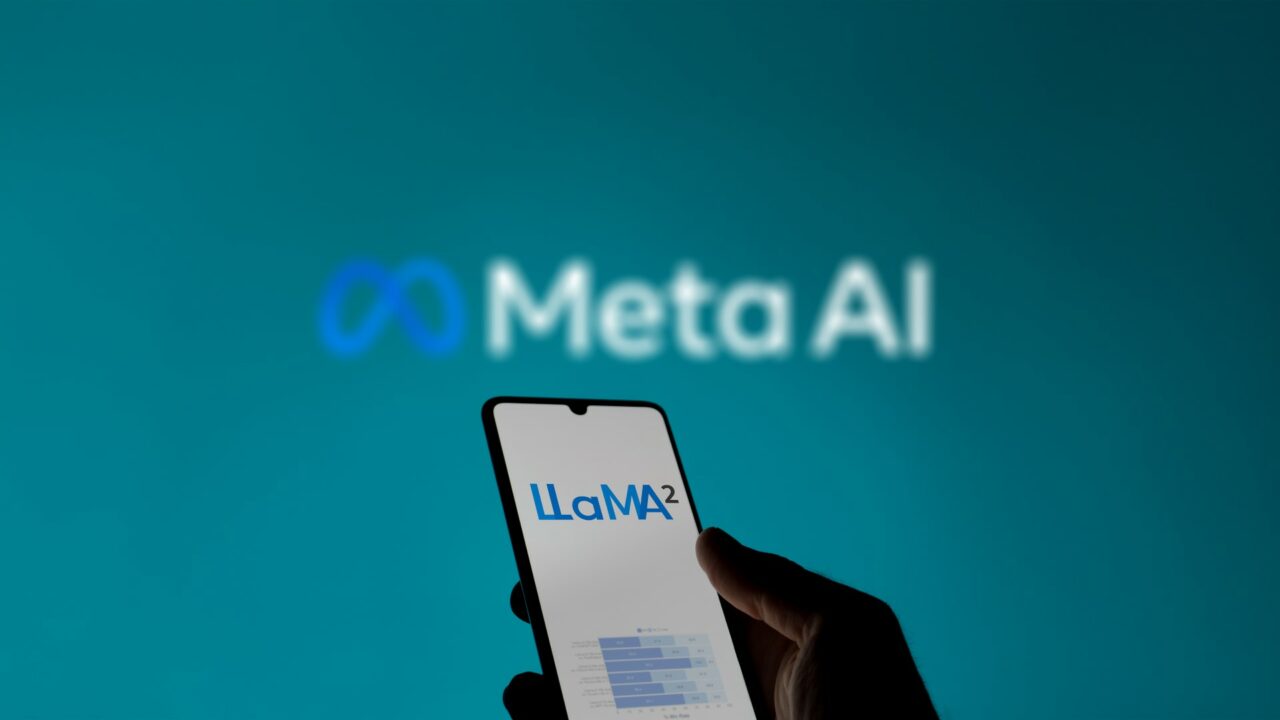 September 11th 2023 in France, someone looking the page of LlaMa 2 on a phone, in a background the blurry logo of Meta AI.